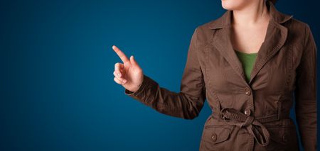 Young woman pressing imaginary button