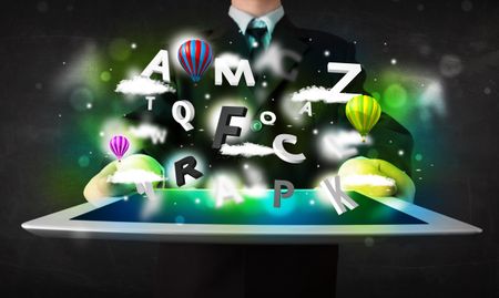 Young person showing white tablet with abstract letters and sky