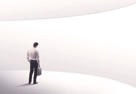 Young sales business person in elegant suit standing with his back in empty white space background with curved lines concept