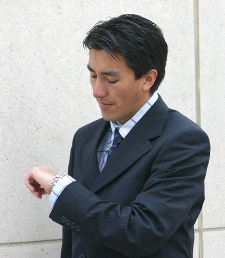 business man looking at watch