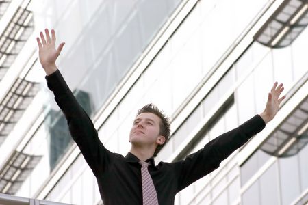 business man with arms up, victory and freedom