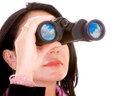 business woman doing a search with her binoculars - isolated over a white background