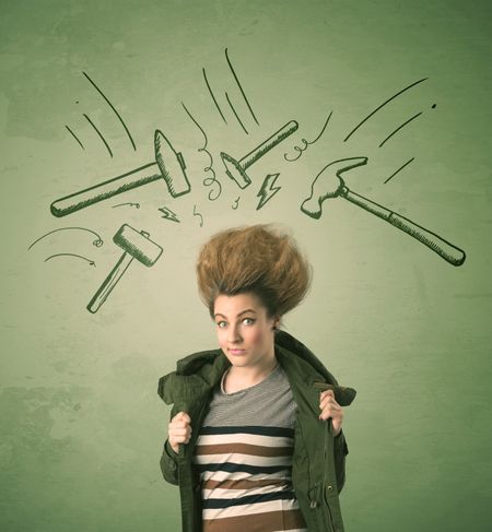 Tired woman with hair style and headache hammer symbols concept on background