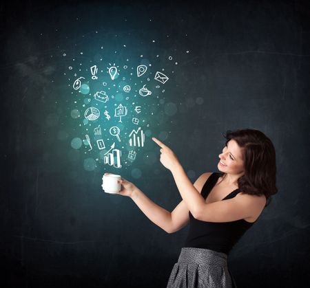 Businesswoman standing and holding a white cup with business icons coming out of the cup