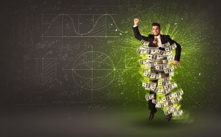 Cheerful businesman jumping with dollar banknotes around him on background