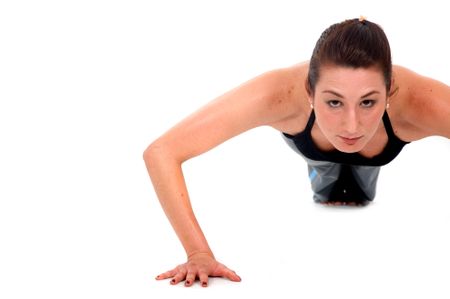 girl doing exercise - push ups over a white background