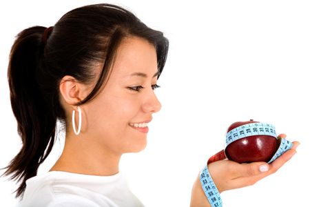 beautiful girl on an apple diet to lose weight - isolated over a white background
