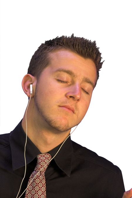 business man enjoying his music on a personal stereo