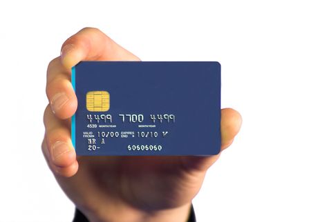 hand holding a credit card over a white background - note: numbers on credit card are made up