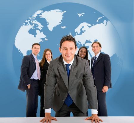 Business team in front of a world map