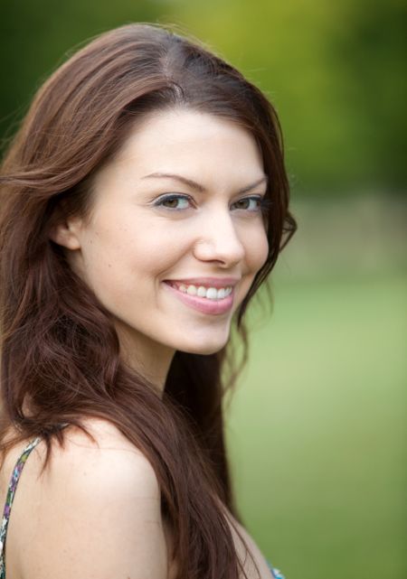 Portrait of a beautiful female smiling outdoors