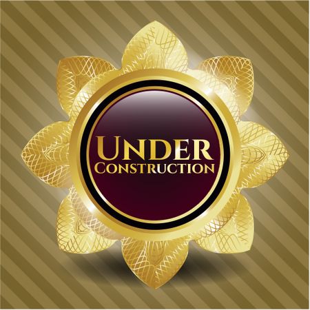 Under Construction gold emblem