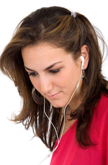 girl listening to music on her mp3 player - isolated over a white background