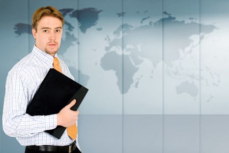 business man portrait - traveller with the world map in the background in an office environment