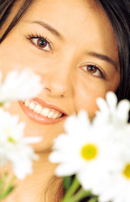beautiful girl with white flowers in front of her face