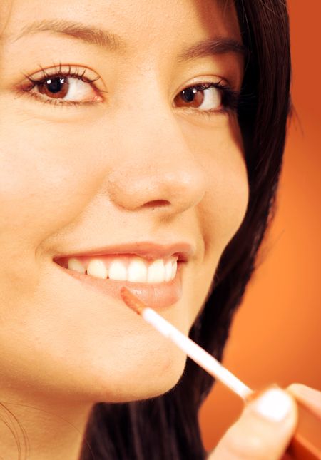 girl-applying-beauty-products-face-lipstick-3538656 girl applying beauty products on her face - lipstick