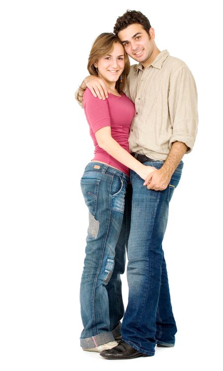 happy couple smiling and hugging - standing isolated over a white background