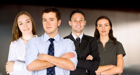 confident business man and his business team - group formed of caucasian people  in an office environment