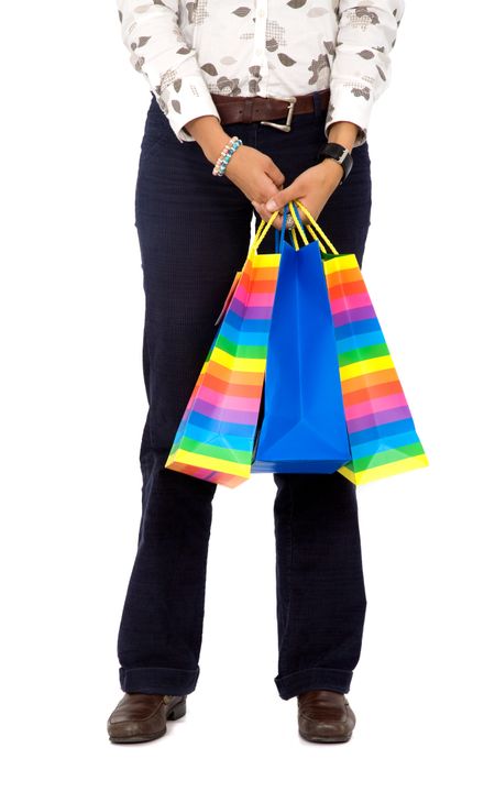 woman with shopping bags isolated over a white background