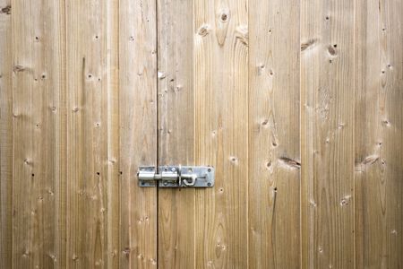 Wooden shed door with locking bolt