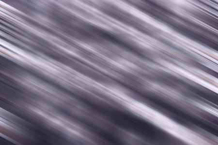 Motion blur of diagonal streaks in grayish blues and violets with greater definition at either end for decoration and background