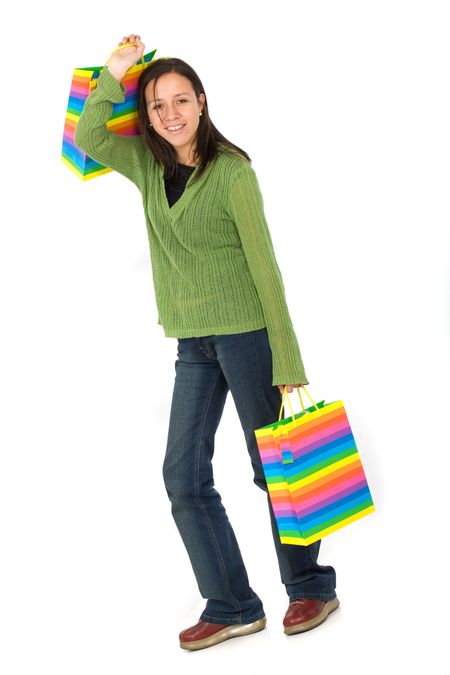 happy girl smiling holding shopping bags - isolated over a white background