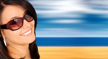 beach fashion portrait of a girl wearing sunglasses