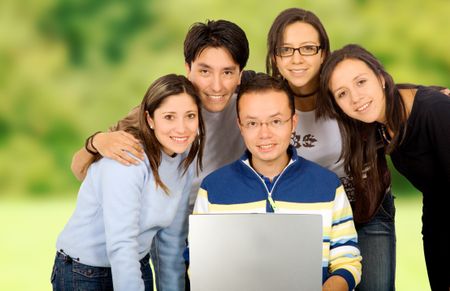 Casual group of students smiling outdoors in a park