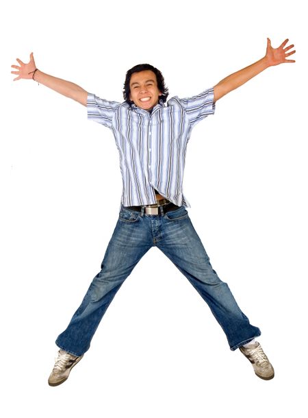 casual man jumping in the air with his arms open and a big smile on his face - isolated over a white background