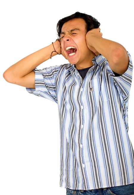 casual annoyed man screaming and covering his ears because he can't stand the noise - isolated over a white background