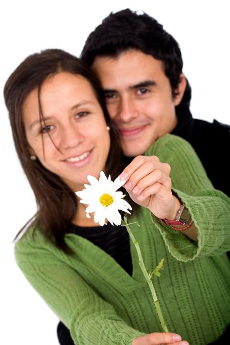 couple in love with a daisy flower - isolated over a white background with the focus on the flower