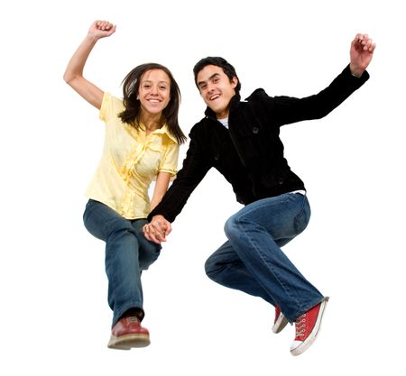 happy couple jumping of joy - isolated over a white background