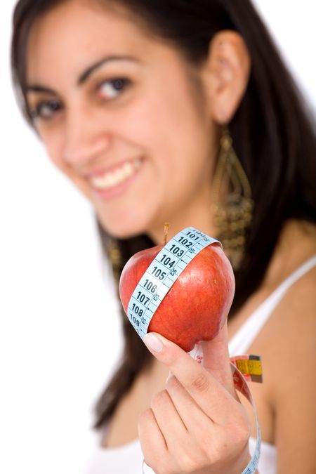 girl on a healthy diet holding a red apple on her hand