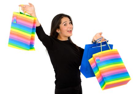 happy woman smiling holding shopping bags - isolated over a white background
