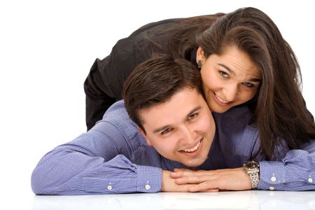 happy couple smiling on the floor - over a white background