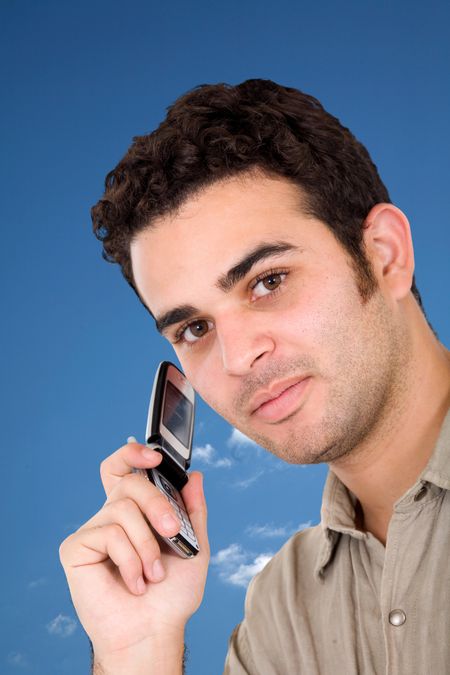 Man talking on his mobile phone outdoors