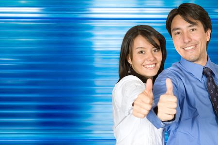 Business couple with their thumbs up over a blue background