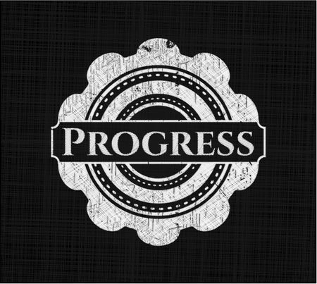 Progress chalkboard emblem on black board