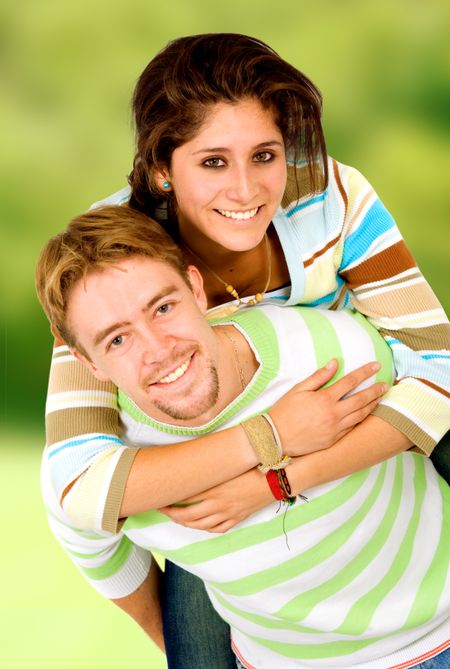 couple having fun outdoors on a green background