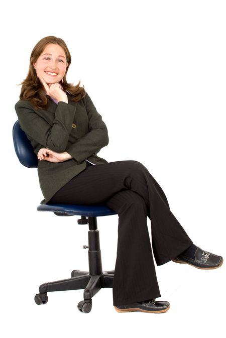 business woman sitting down on a chair - isolated over a white background