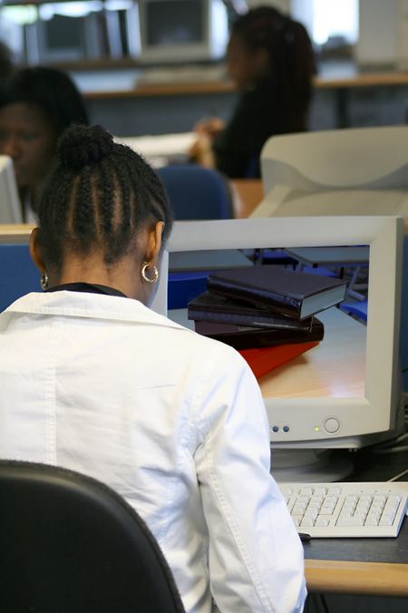 female worker on a computer - image on the monitor is mine too