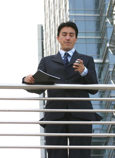 business-man-dialing-mobile-phone-360341 business man dialing on a mobile phone