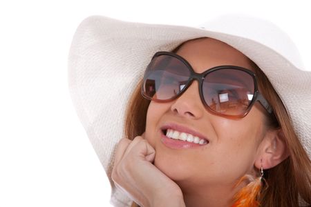 Fashionable woman wearing a hat and sunglasses isolated