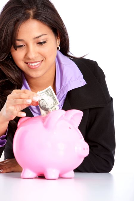 Business woman saving money in a piggy bank isolated