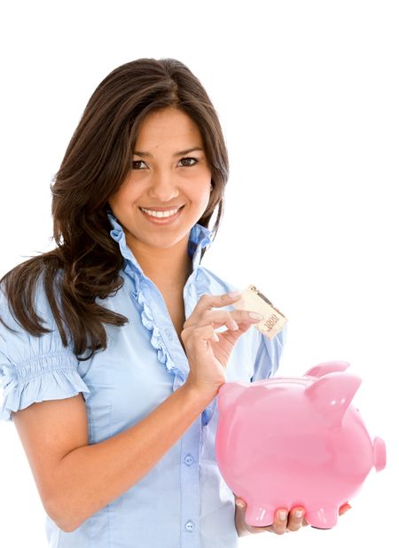 Female saving money in a piggy bank isolated