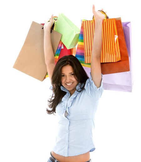Beautiful woman with shopping bags isolated over white