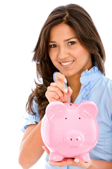 Woman saving money in a piggy bank isolated