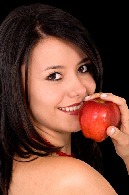 girl eating an apple over a white background