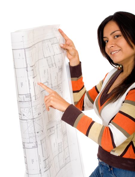 girl holding blue prints while smiling at the camera - isolated over a white background
