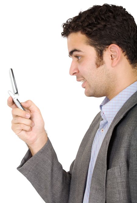 Business man on the phone sending an sms and smiling - isolated over a white background